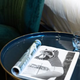 A magazine placed on a blue tray