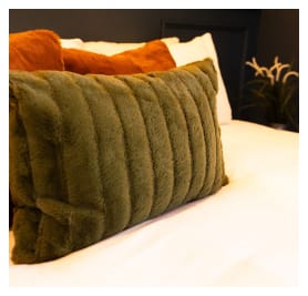 A serene bedroom scene with a comfortable pillow