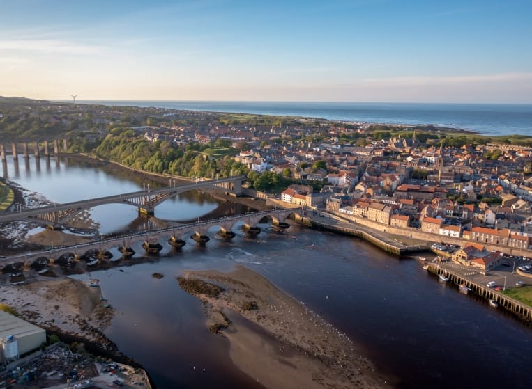 Aerial view of a picturesque town by a winding river